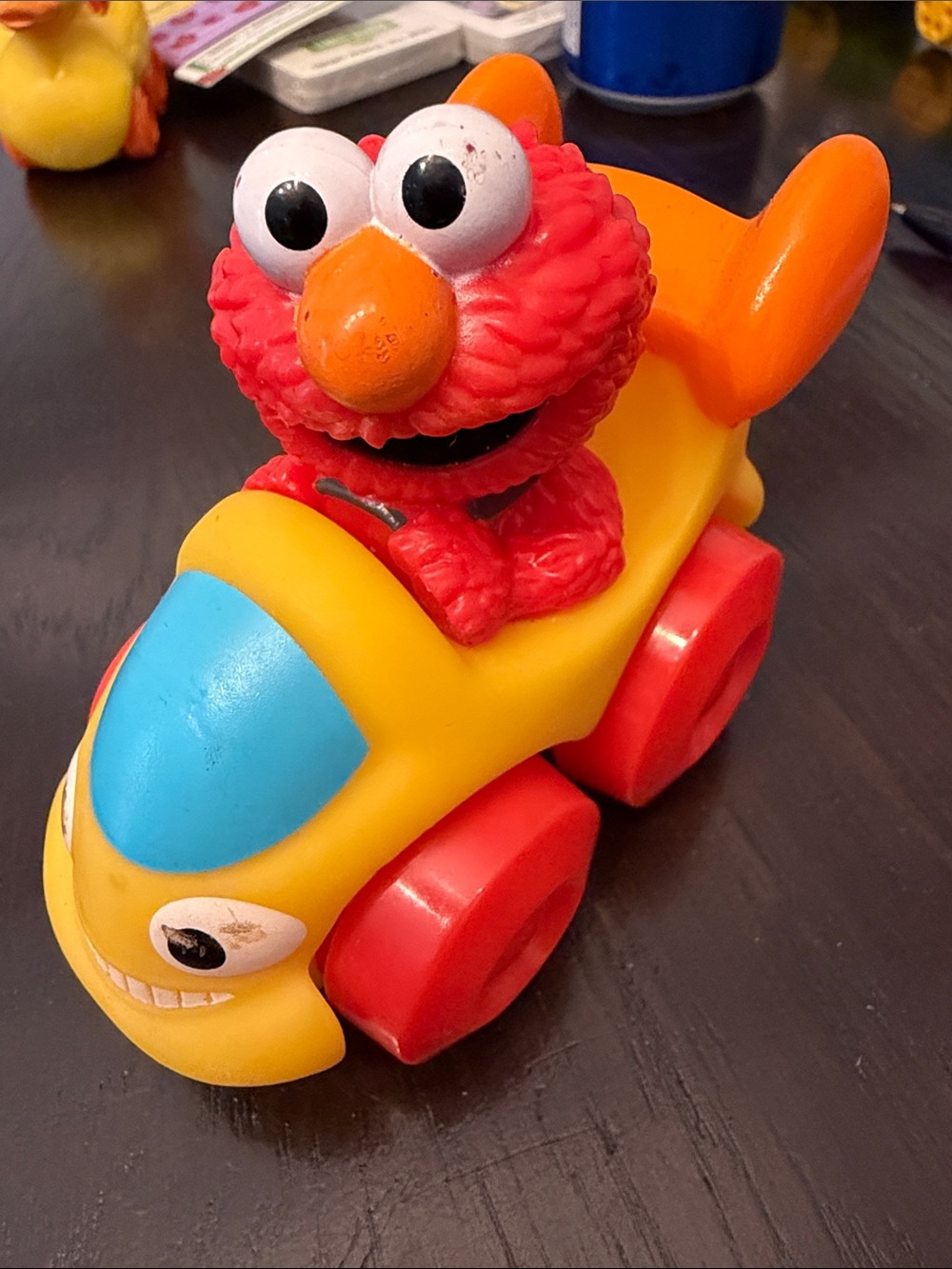 Sesame Street Elmo in Yellow Ride-On Toy Car with Blue Windshield